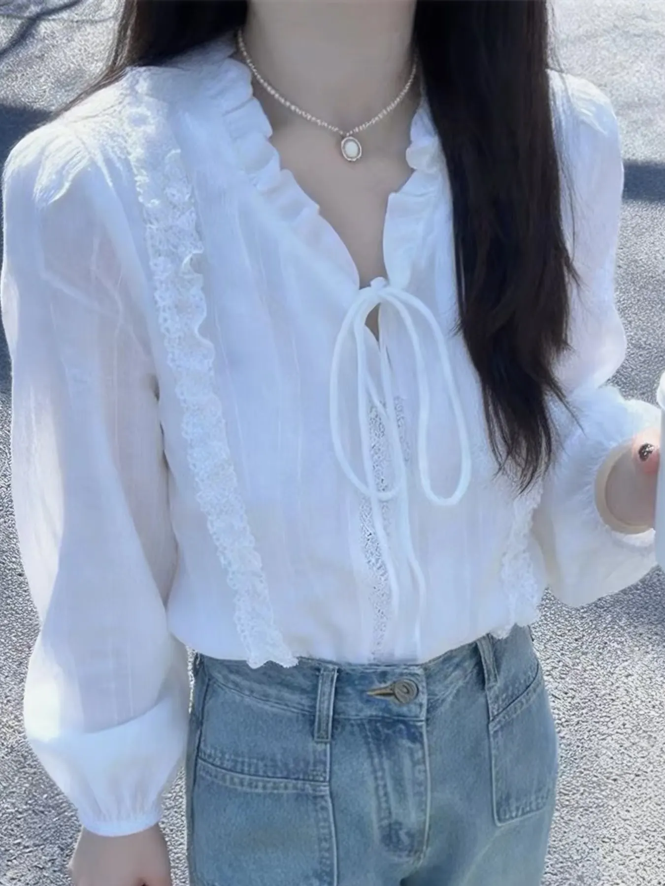 Elegant Lace-Trimmed Ruffle Blouse with Tie-Neck Detail